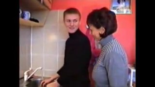 Russian mom Amalia with her boy in kitchen 